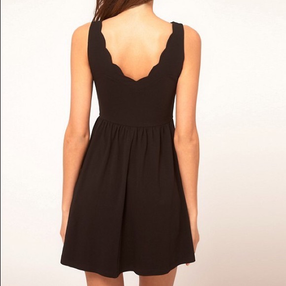 black dress with scalloped neckline